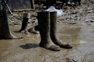 a pair of wellies that have been abandoned after becoming stuck in deep mud.