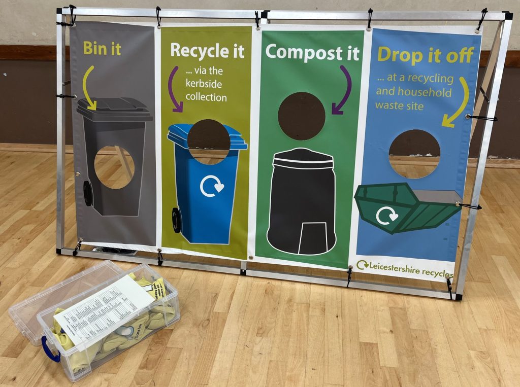 A display with bin it, recycle it, compost it and drop it off written.